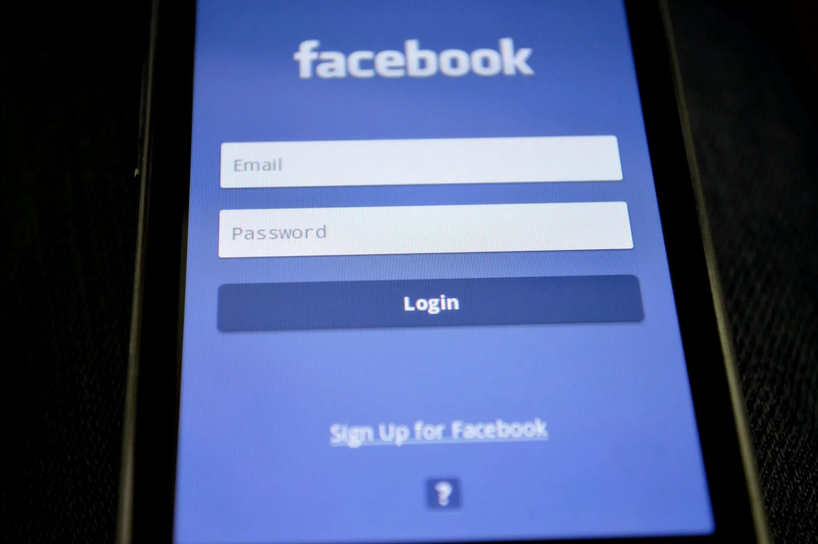 A smartphone lock screen showing a password prompt, the moment a device security alert warns that a saved password appeared in a data leak.