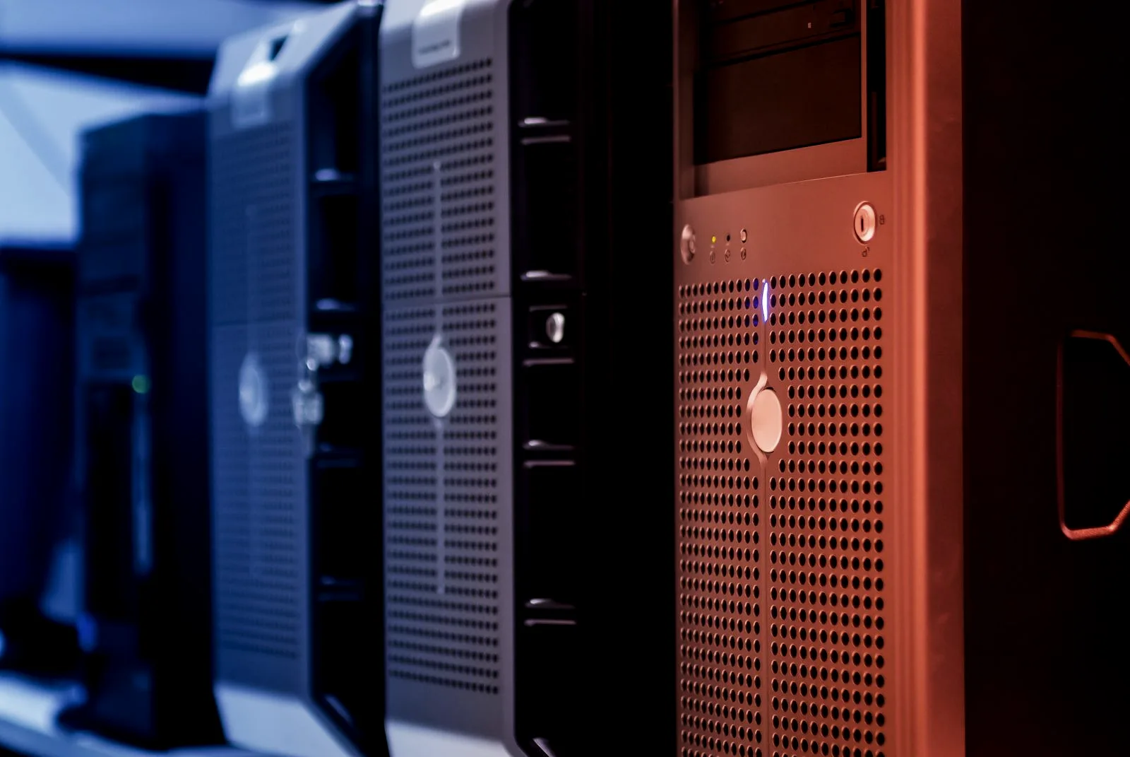 Rows of dark server racks in a data center, the corporate systems that credentials from stealer logs ultimately open.